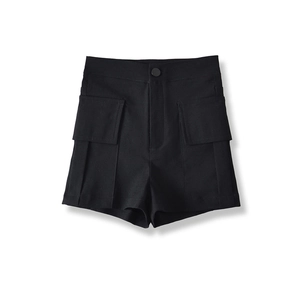 Close-up of black high-waisted cargo shorts showing large flap pockets and fabric texture