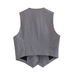 Rear view of black and white gingham vest with slim fit cut and V-shaped split hem detail