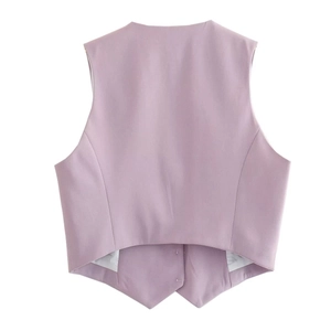 Detailed back view of a lavender woven vest showing tailored waist and sharp hemline
