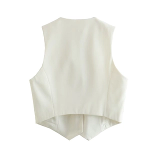 Detail view of the pointed hemline and premium white fabric texture on a tailored vest