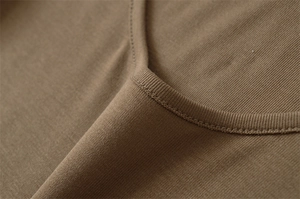 Close-up of the low U-neckline on a khaki slim fit top showing high-quality stitching