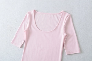 Detailed flat lay of pink slim-fit t-shirt with deep U-neckline and mid-length sleeves