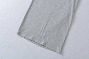Detail of grey short sleeve dress showing high-quality double-needle hem and jersey fabric