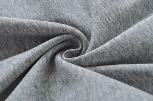 Detailed macro view showing the soft gray pleated knitted fabric and its fine texture