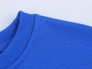 Close-up of bright blue knit T-shirt showing ribbed neckline and fine fabric texture