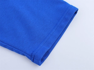 Close-up of high-quality double-needle stitching on royal blue cotton T-shirt sleeve
