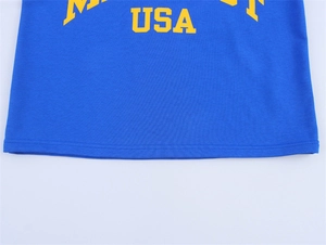 Close-up of bright blue cotton T-shirt with vintage yellow USA and Minnesota letter print