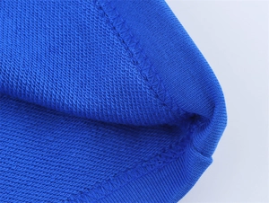 Detail shot of blue French Terry fabric showing high-quality stitching and loop texture