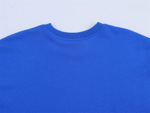 Detailed macro shot of royal blue cotton T-shirt neckline with ribbed knit finish