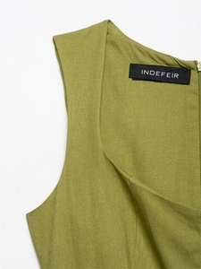 Detail of minimalist V-neckline and back zipper on moss green linen midi dress