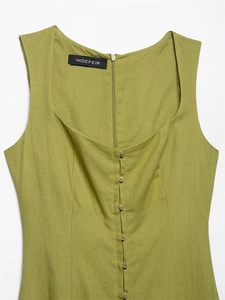 Detail view of olive green linen dress with square neckline and natural wood buttons