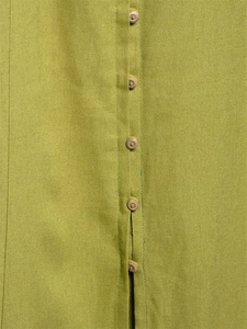 Macro shot of avocado green linen midi dress featuring a neat brown button placket detail