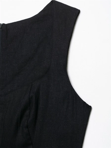 Close-up of black linen midi dress featuring a seamless invisible zipper and fabric texture