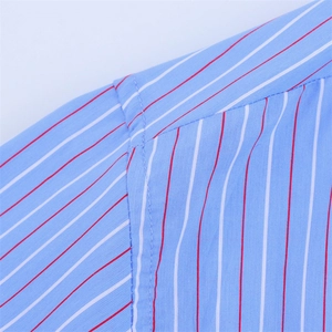 Detail view showing professional stitching and red-white stripes on light blue cotton fabric