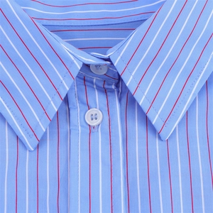 Close-up detail of light blue striped cotton shirt with button collar and fine stitching