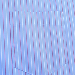 Close-up of light blue striped cotton shirt featuring a front pocket and red white stripes