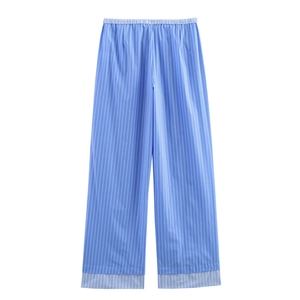 Detail view of blue and white vertical striped casual cotton trousers with elastic waist