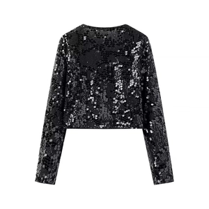 Detail of black sequin cropped jacket showing wavy embroidery patterns on polyester fabric