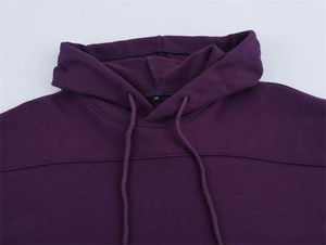 Macro view of the purple hoodie neckline with size M label and drawstring detail