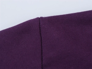 Detail of flat shoulder stitching on deep purple knit cotton long sleeve hoodie