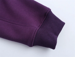 Detail shot of the high-density ribbed cuff on this dark purple hooded sweatshirt