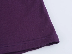 Close-up of high-quality double-needle flat stitching on deep purple knit hoodie hem