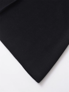 Close-up view of premium black knit fabric texture and fine stitching detail on a vest