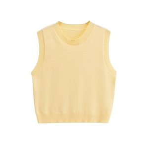Close-up of the fine ribbed texture on the hem and neckline of a pale yellow knit vest