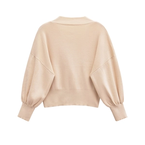 Short beige knitted sweater with floral buttons and relaxed drop shoulder design