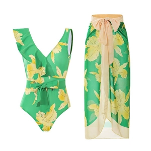 Detail of emerald green floral swimsuit with ruffled shoulder and matching sarong skirt