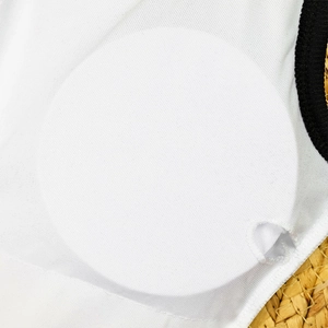 Close-up of removable padding inserts and inner mesh lining of white one-piece swimsuit