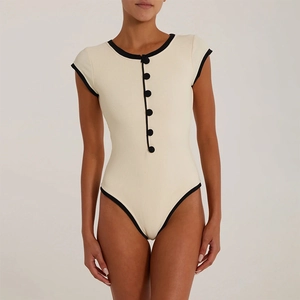 Sexy cream ribbed one-piece swimsuit with black contrast trim and decorative buttons