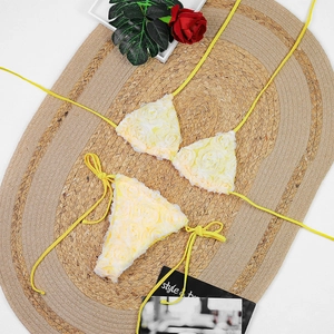 Detail of 3D rose petal fabric on light yellow bikini top with chic halter neck ties