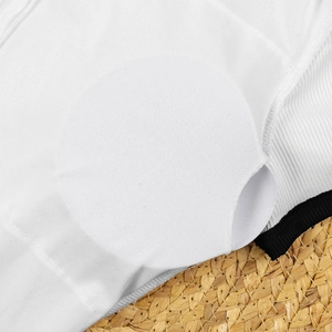 Detail of white swimsuit interior with breathable mesh lining and removable pad slots