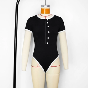 Detail of ribbed knit black bodysuit with white contrast piping and zipper closure