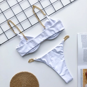 Detail view of white bikini set with gold metal chain straps and underwire cups