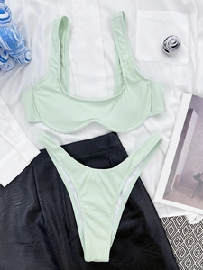 Detail of mint green ribbed bikini set featuring underwire support and textured fabric