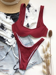 Close-up of wine red ribbed bikini set with wide straps and textured fabric detailing