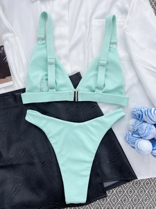 Detail of ribbed mint green bikini set with adjustable straps and front buckle closure