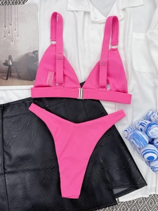Detail of ribbed texture and fabric composition on pink triangle bikini set