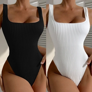 Detail view of ribbed texture and square neckline on black and white one-piece swimwear
