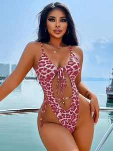 Close-up of red and white leopard print monokini with side cut-outs and lace-up detail