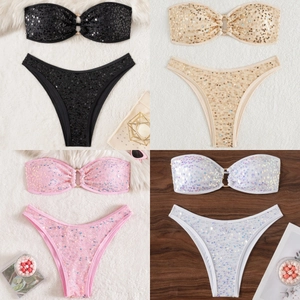 Detail of sequin bikini sets with metal ring decors in black, gold, pink and white