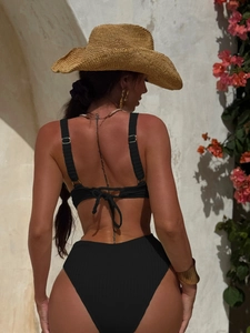 Detailed back view of a black ribbed two-piece bikini with cross-back tie straps