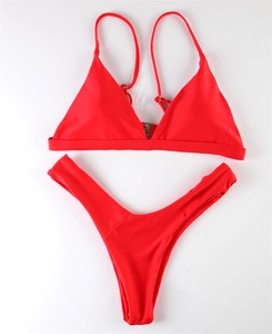 Detailed top view of red two-piece bikini featuring triangle cups and high-cut thong bottom