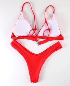 Detailed flat lay of a red triangle bikini set with adjustable straps and silver back clasp