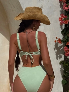 Back view of mint green ribbed bikini set featuring tie-back top and high-waisted bottom