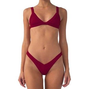 Detail view of burgundy ribbed bikini set featuring V-cut bottoms and fine stitching