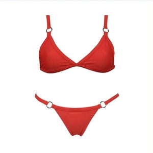 Detail of red bikini set with metallic rings and adjustable thin shoulder straps