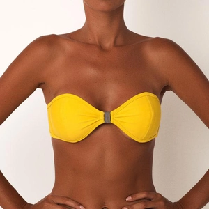 Close-up of bright yellow strapless bikini top with a metallic buckle detail on the chest
